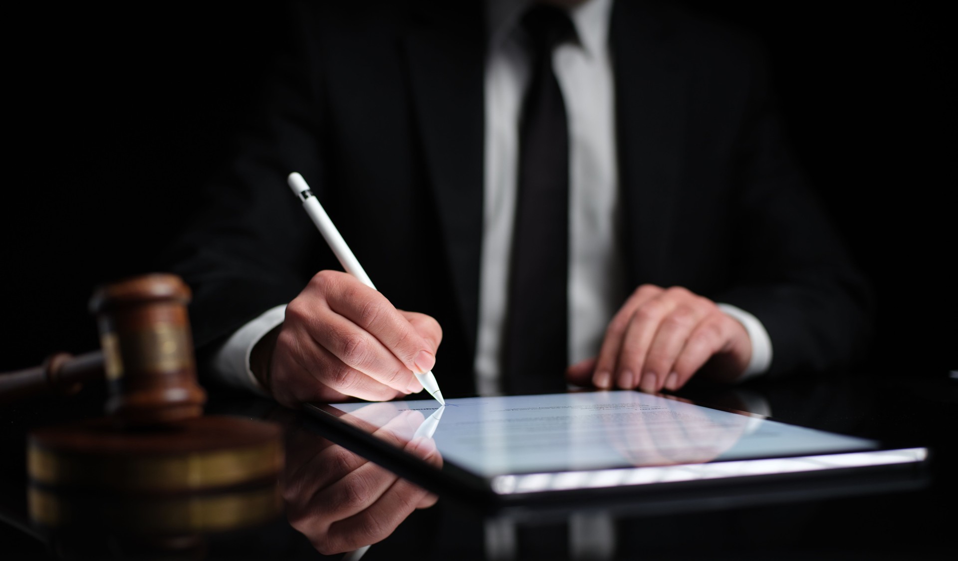 Businessman Signing Digital Contract On Tablet
